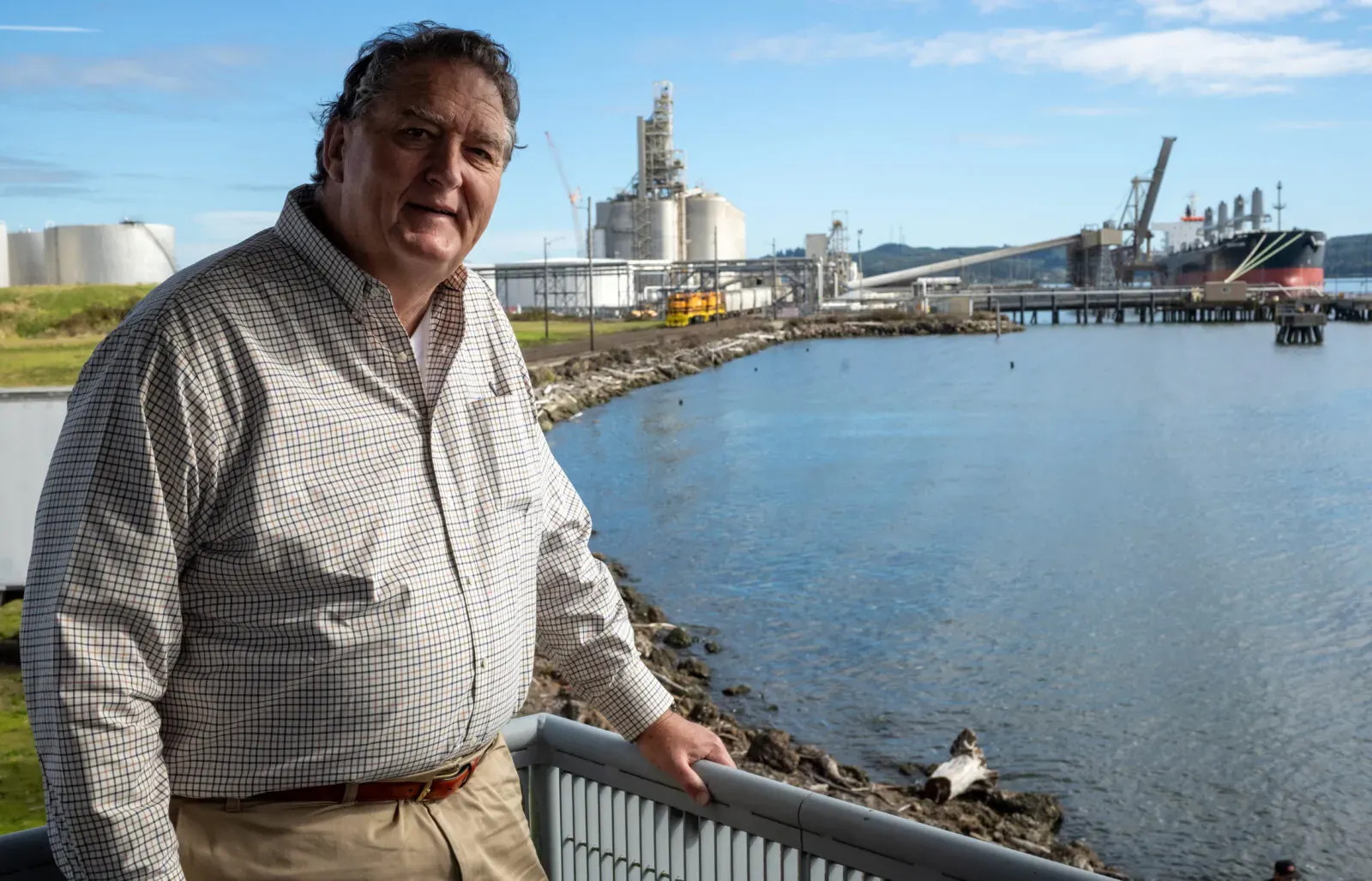 Image of man standing outside of Gray's Harbor